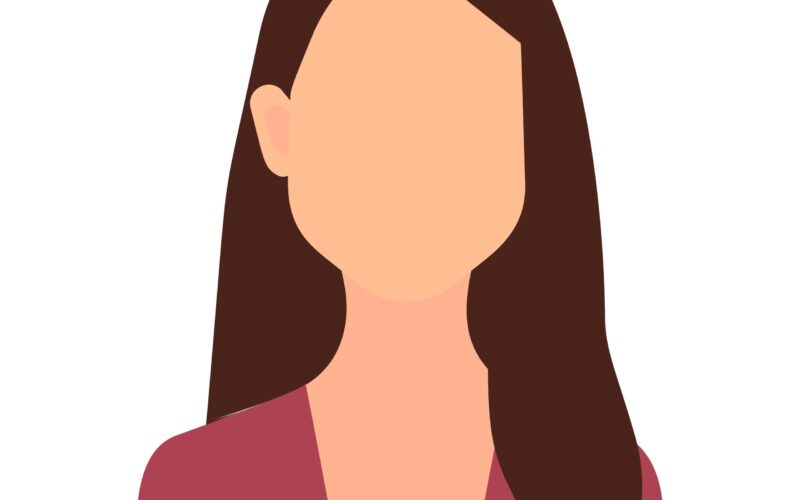 A woman with long brown hair is seen wearing a pink shirt.